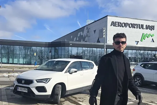 Viocars representative meeting client at Iasi Airport terminal